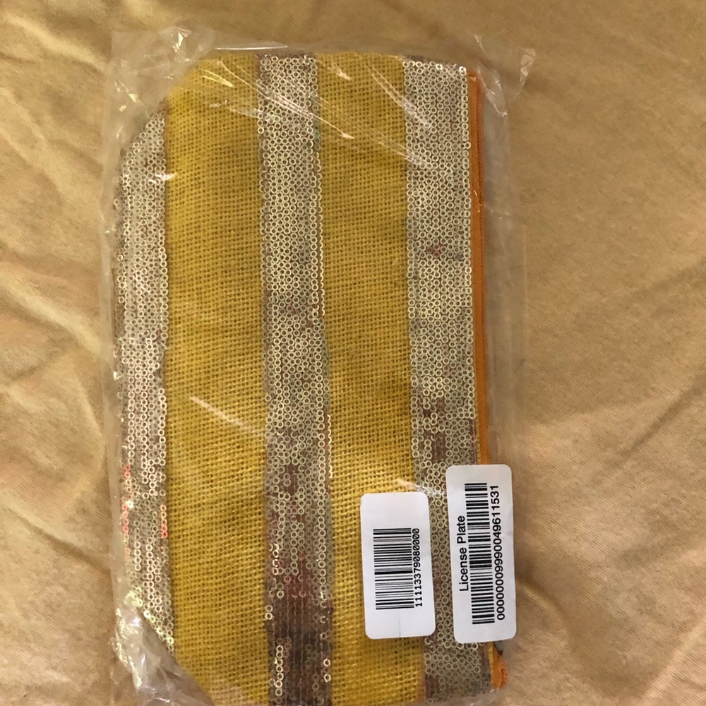Small yellow clutch or makeup bacg